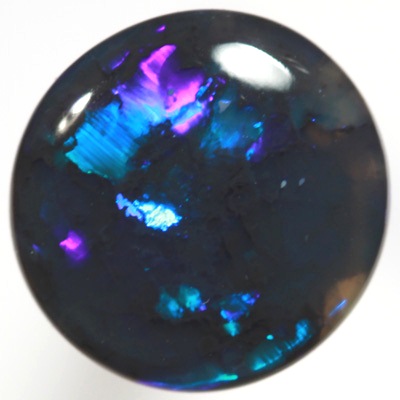 SOLID BLACK OPAL Very bright electric turquoise fire. SEE VIDEO